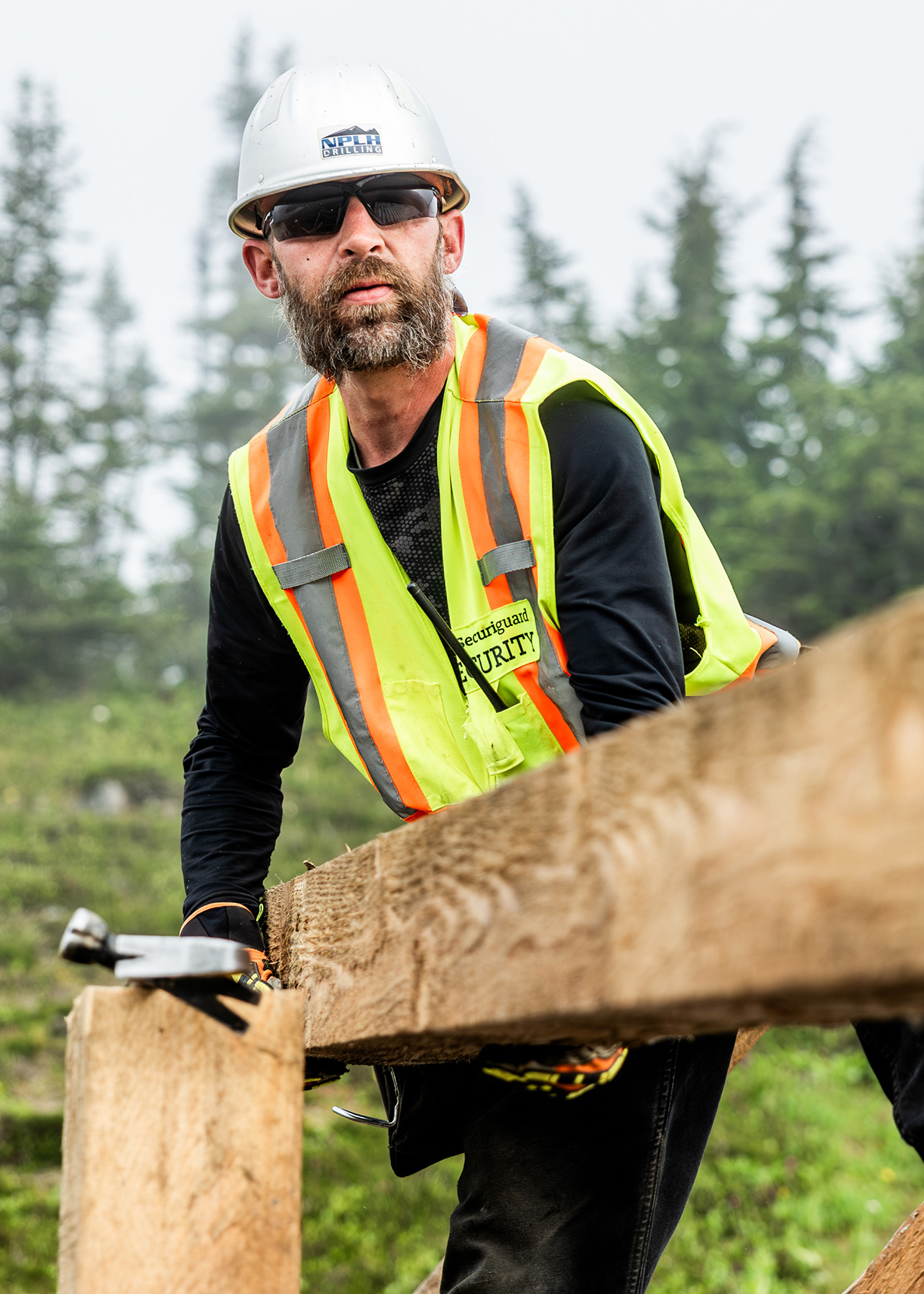 A Man Building A Fence