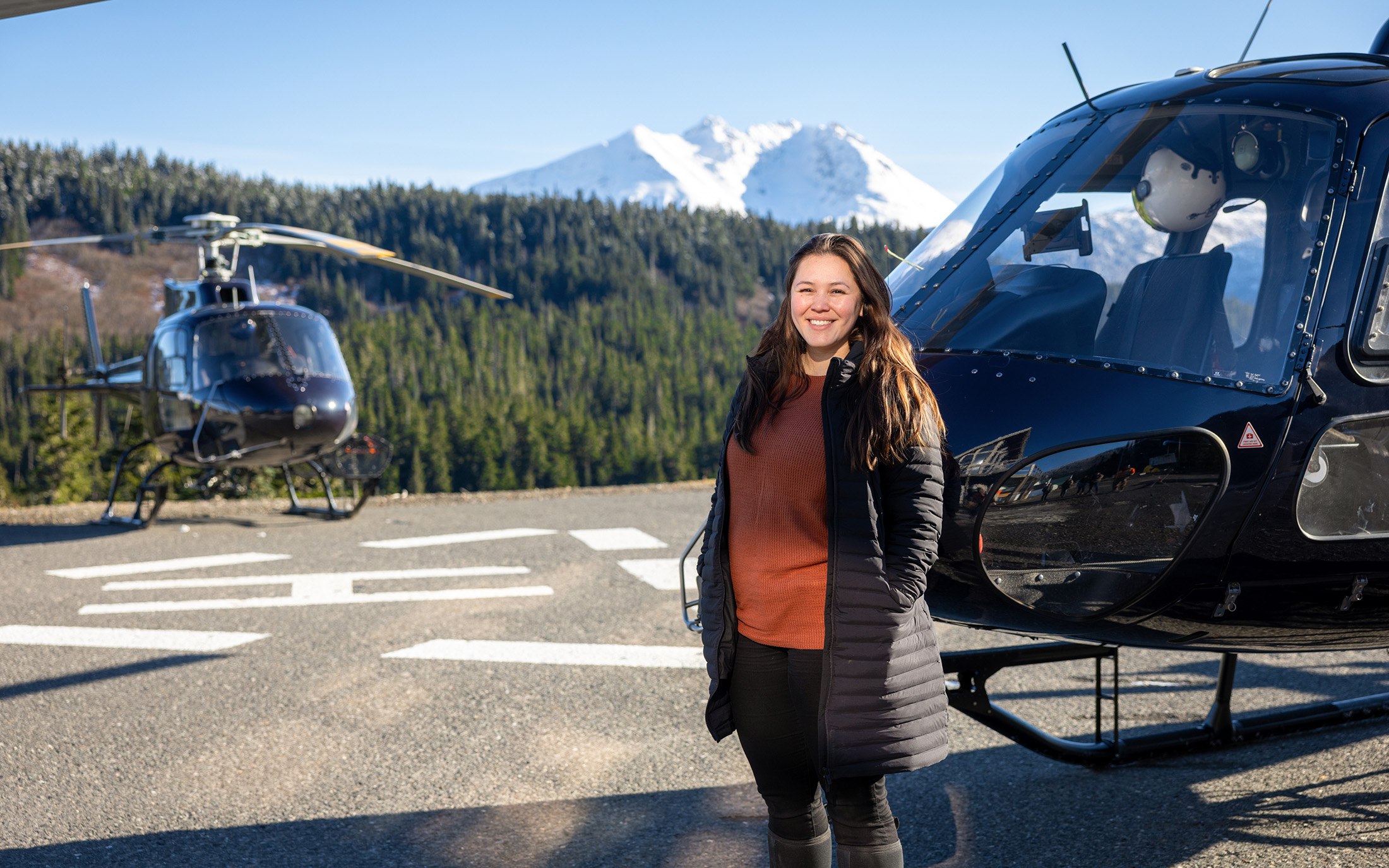 Person Standing In Front Of A Helicopter
