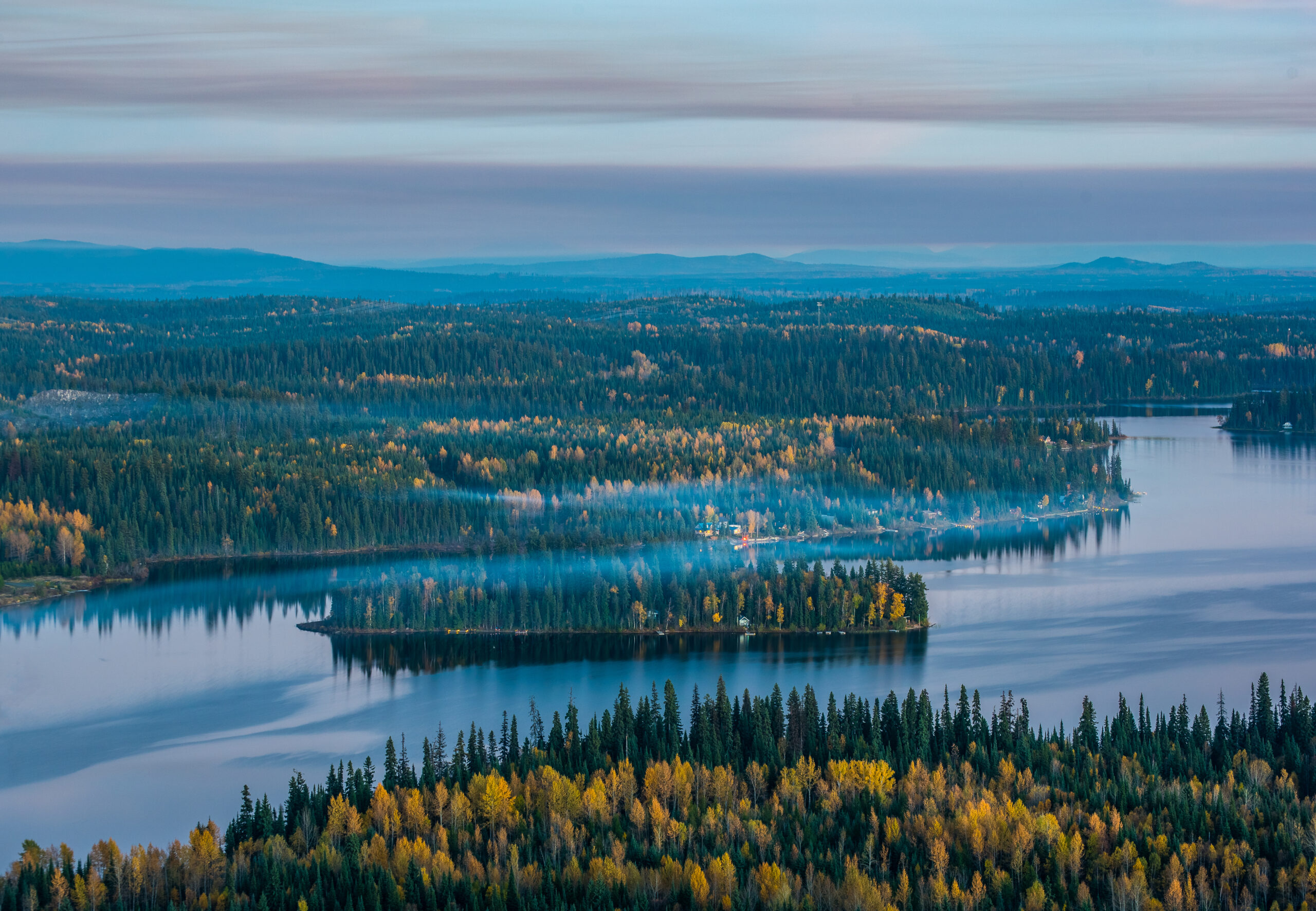 A Hazy Island In Summit Lake Covered In Fall Colors. Shot At Dusk From The Top Of Teapot Mountain Prince George British Columbia Canada